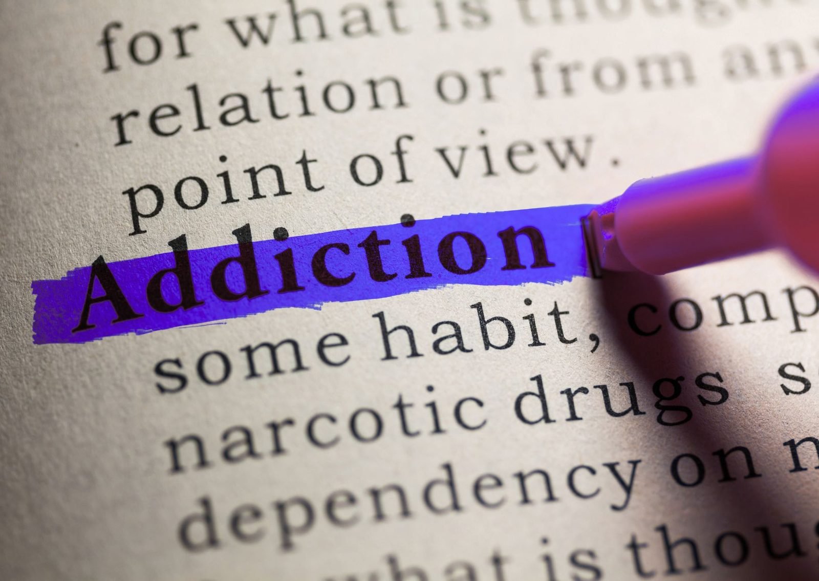 A dictionary entry for the word addiction, highlighted in blue